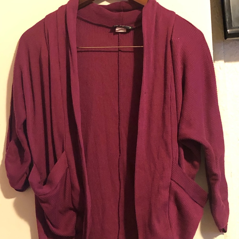 Dark pink sweater.